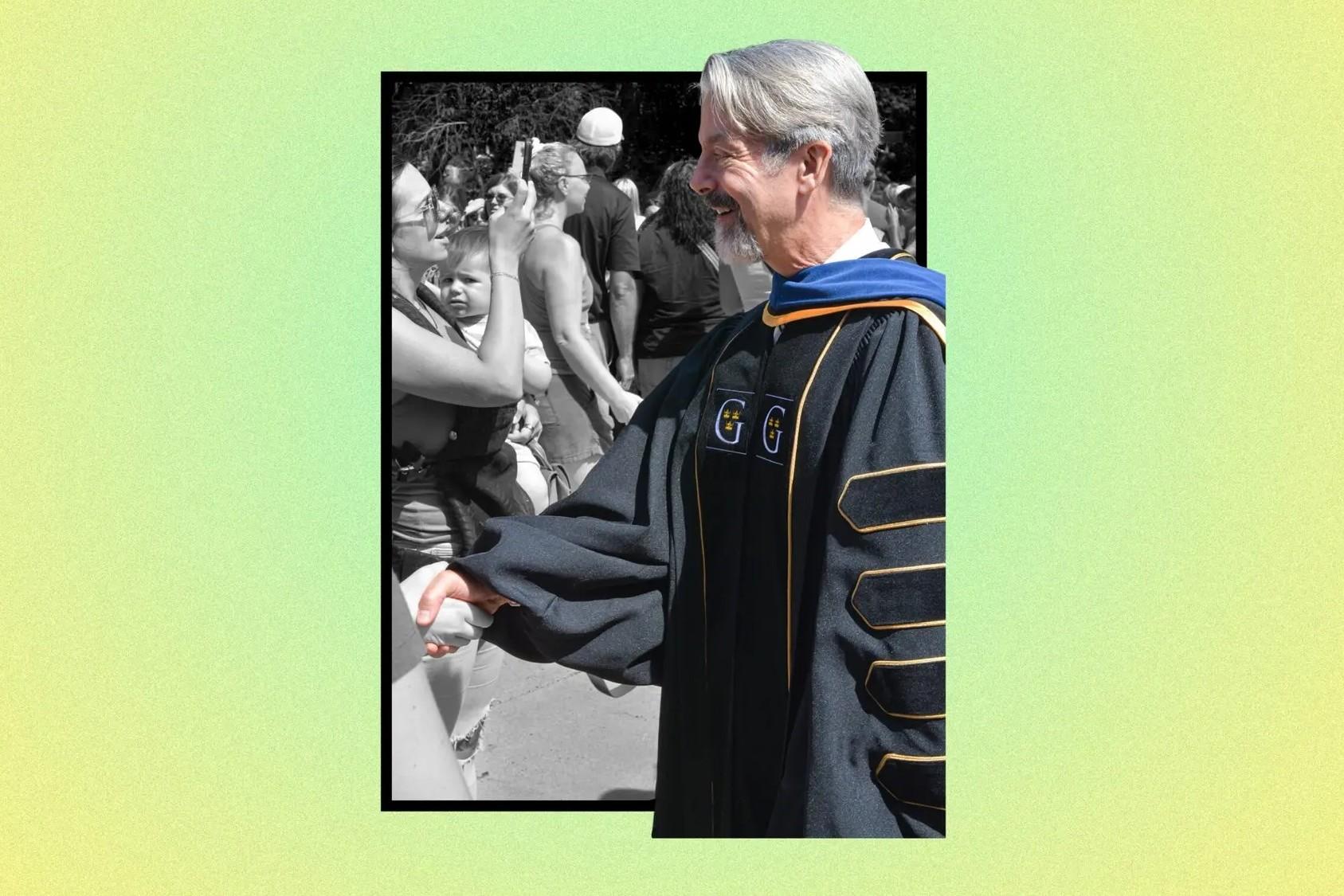 A professor shaking hands with someone